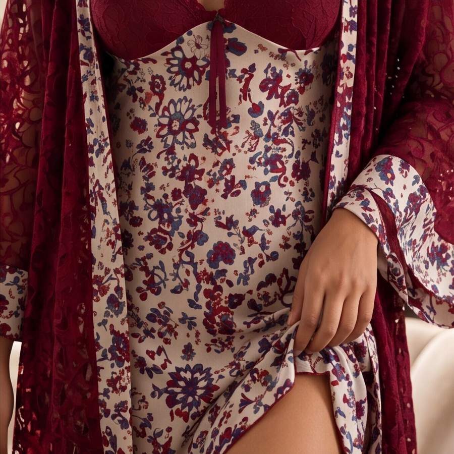 Floral dress with red accents and a matching shawl on a neutral background