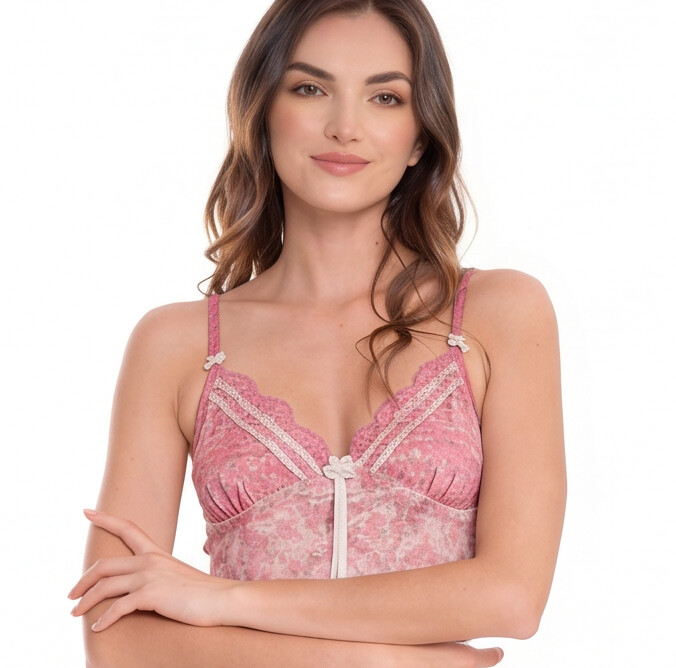 Woman wearing a pink lace top on a white background