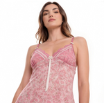 Woman wearing a pink floral nightgown on a white background